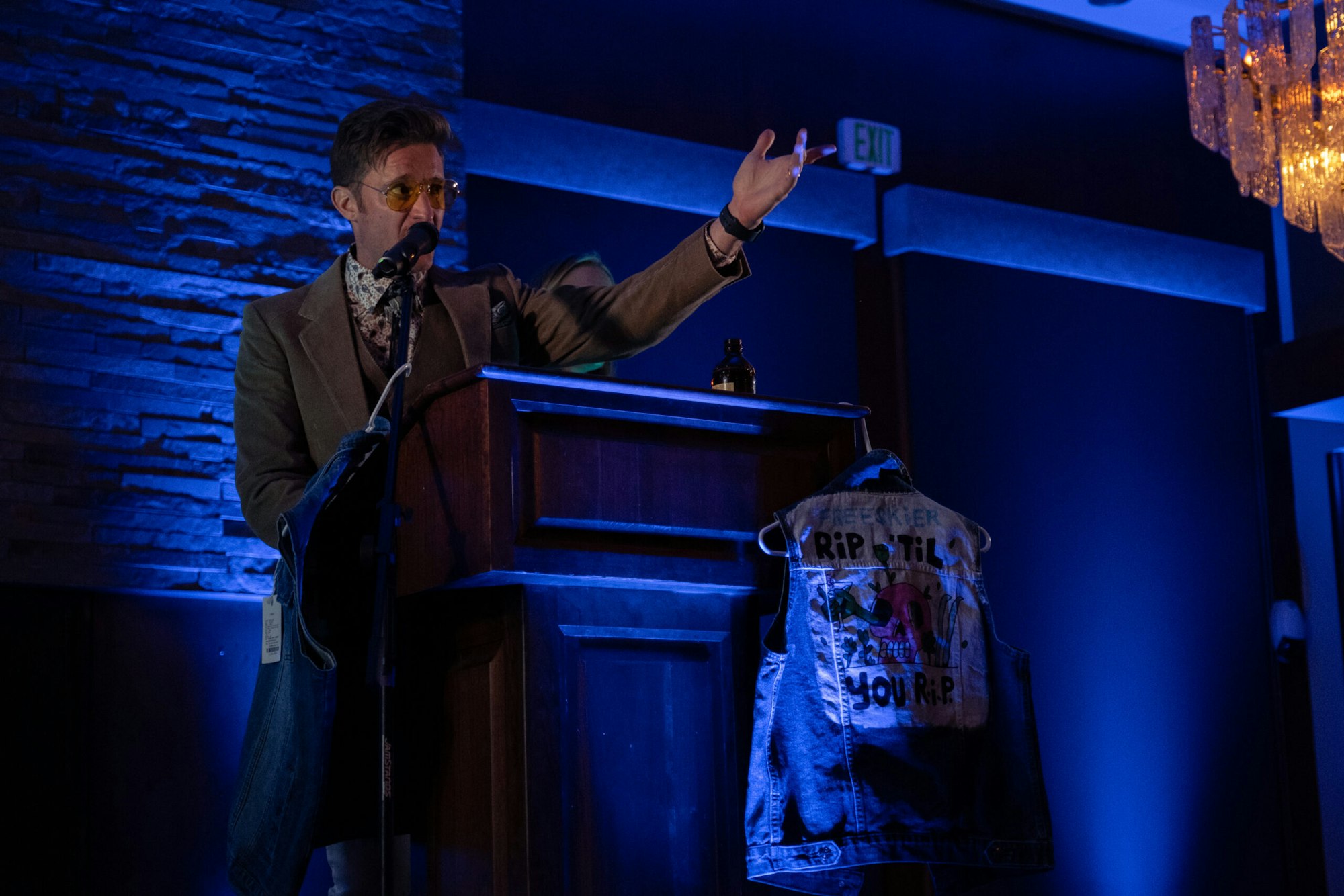 A man makes a speech from a podium