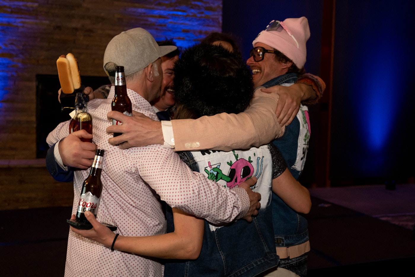 five people in a group hug