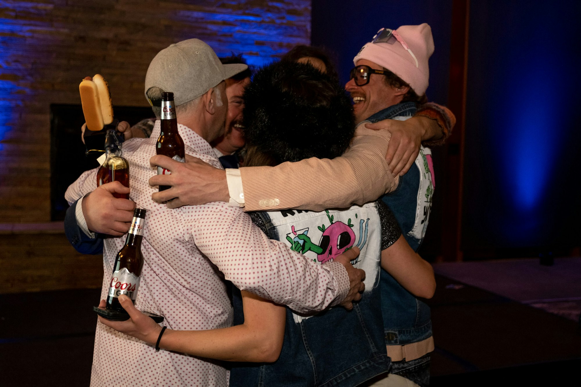 five people in a group hug