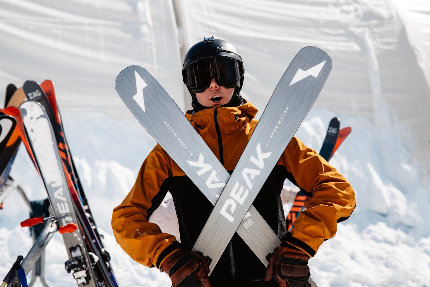 Skier crosses a pair of skis in front of them