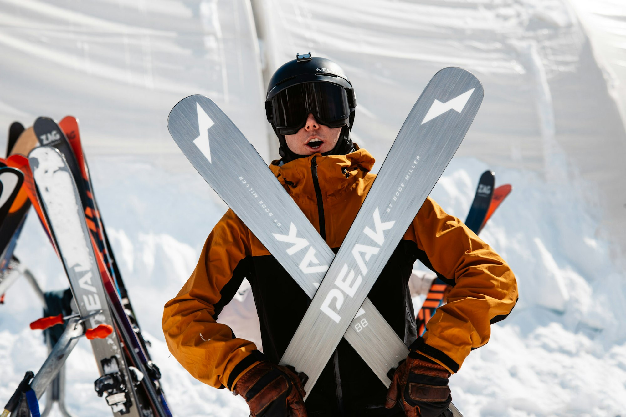Skier crosses a pair of skis in front of them