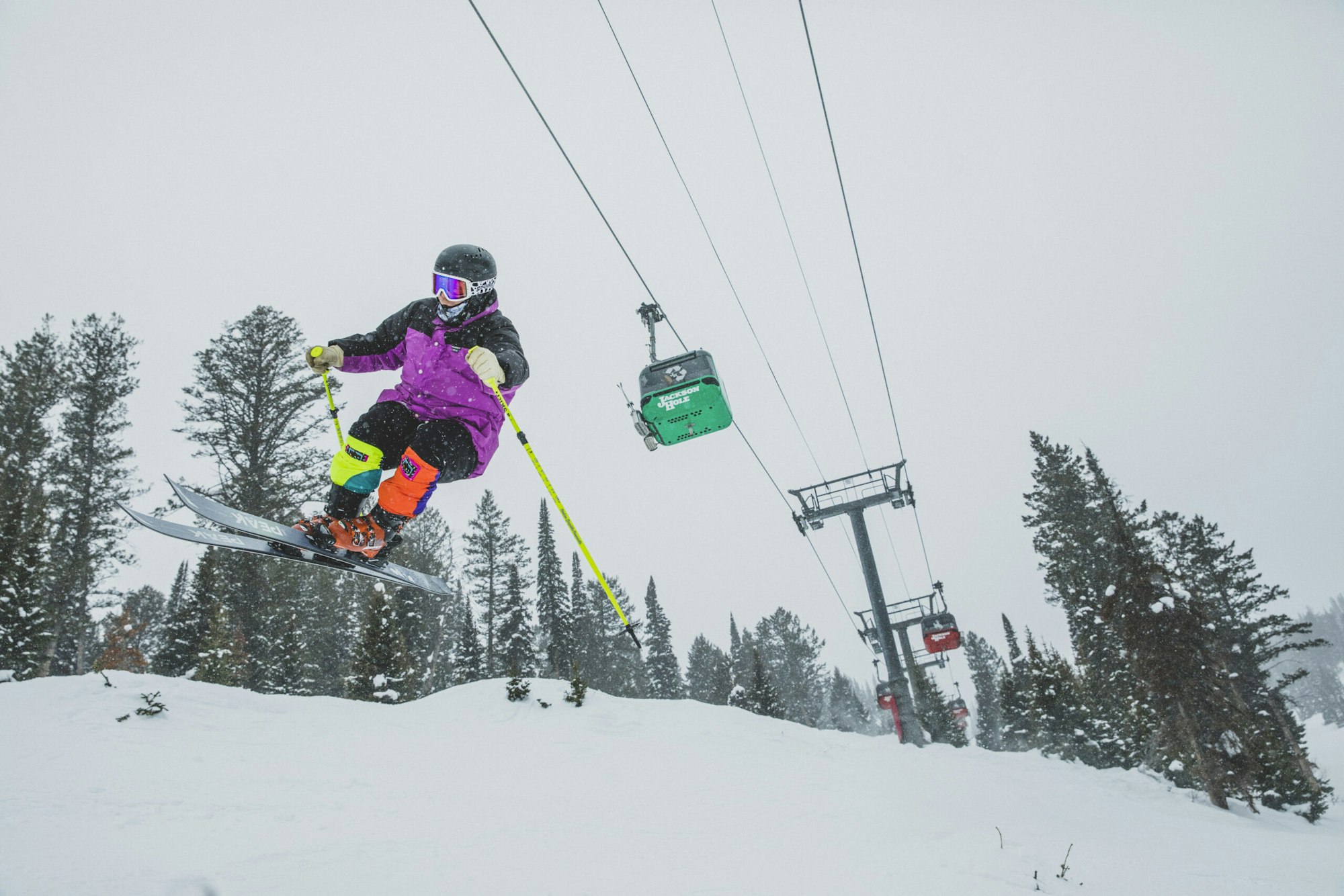 Skier catches air under the Jackson Hole gondola