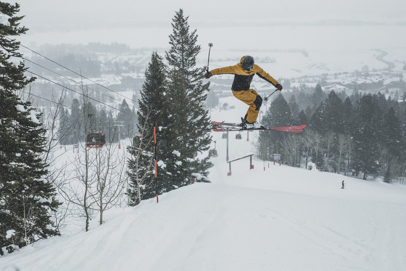 Skiers rotates in the air off a jump