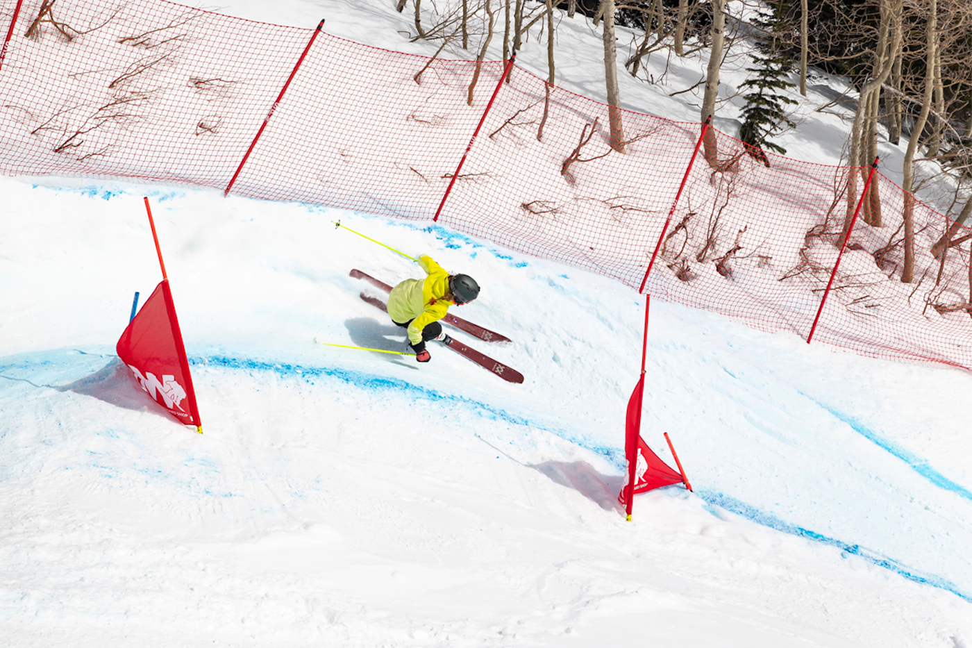 Skier skis through a banked slalom course