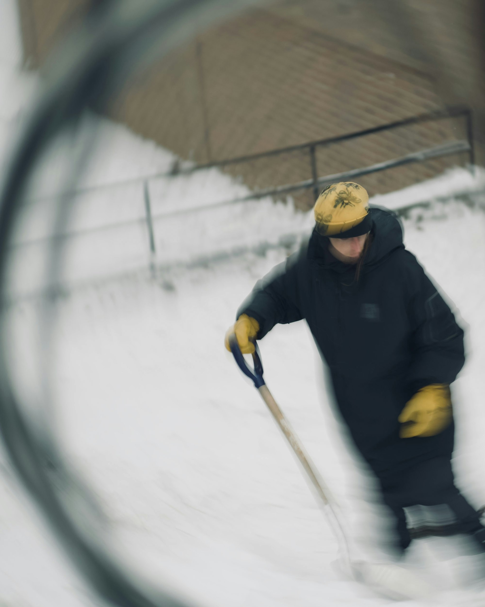Person digs in the snow with a shovel