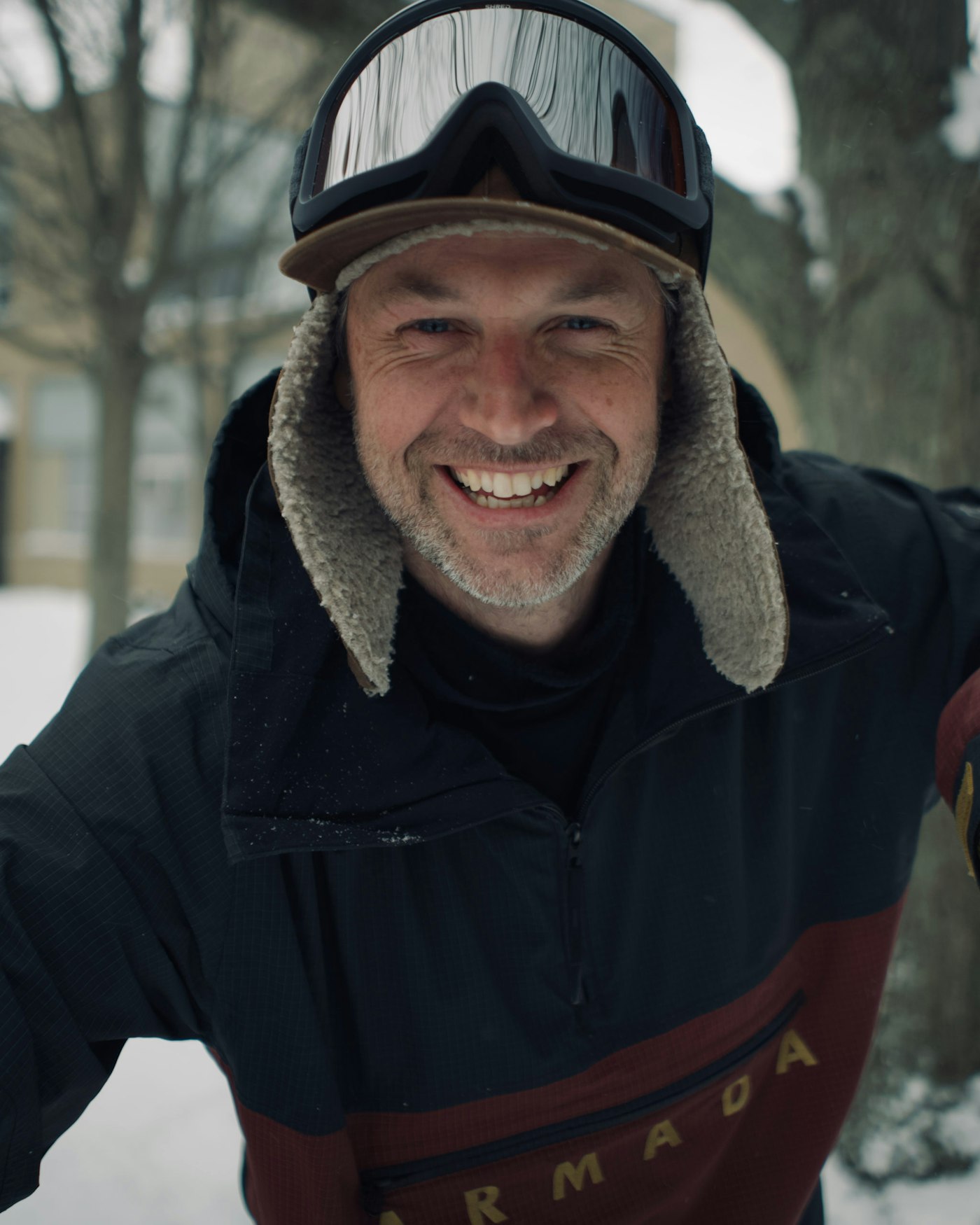 Skiers looks at the camera smiling