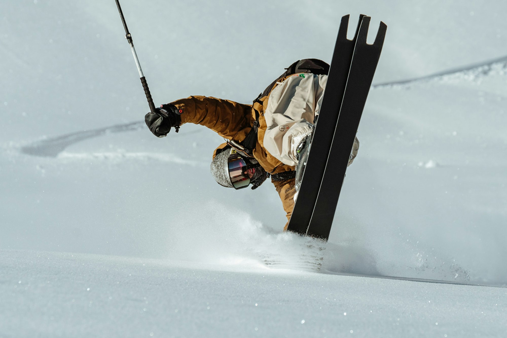 Skier nose butters in deep snow