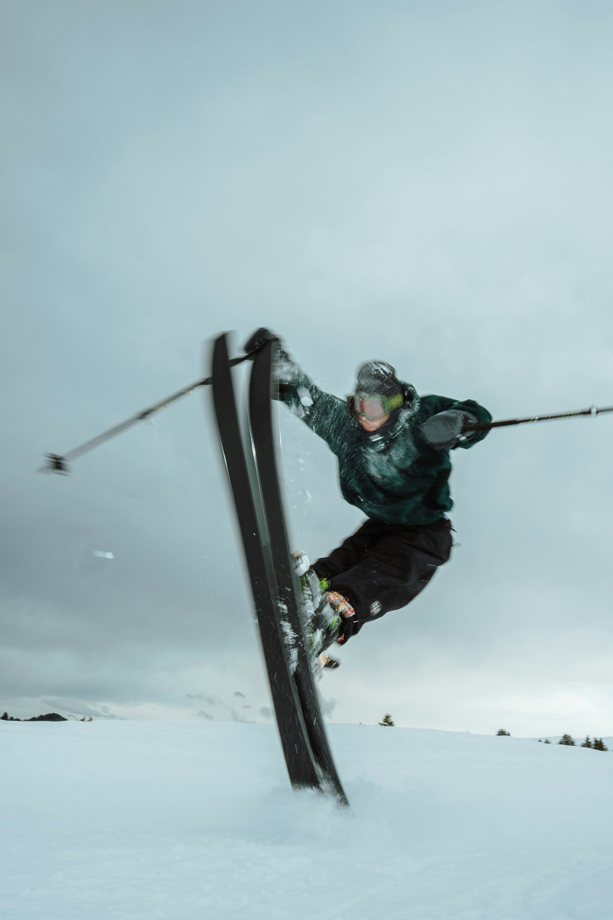 Skier in the air with a nose grab