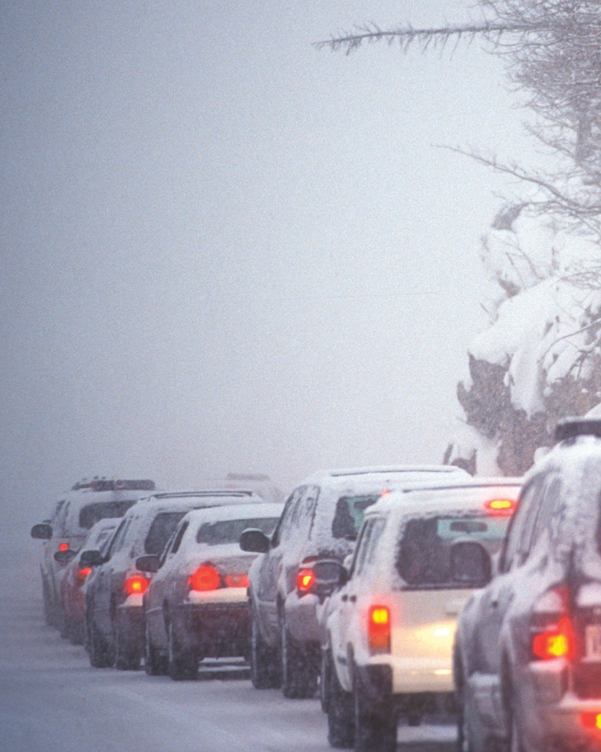 A line of cars on a highway in stopped traffic
