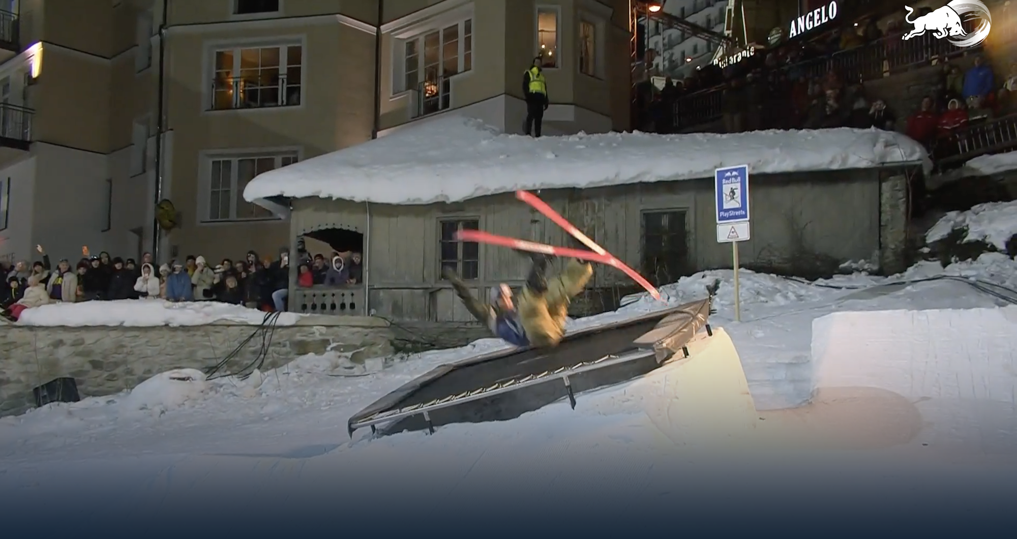Skier at Reb Bull plays trees flips of a stairwell outside