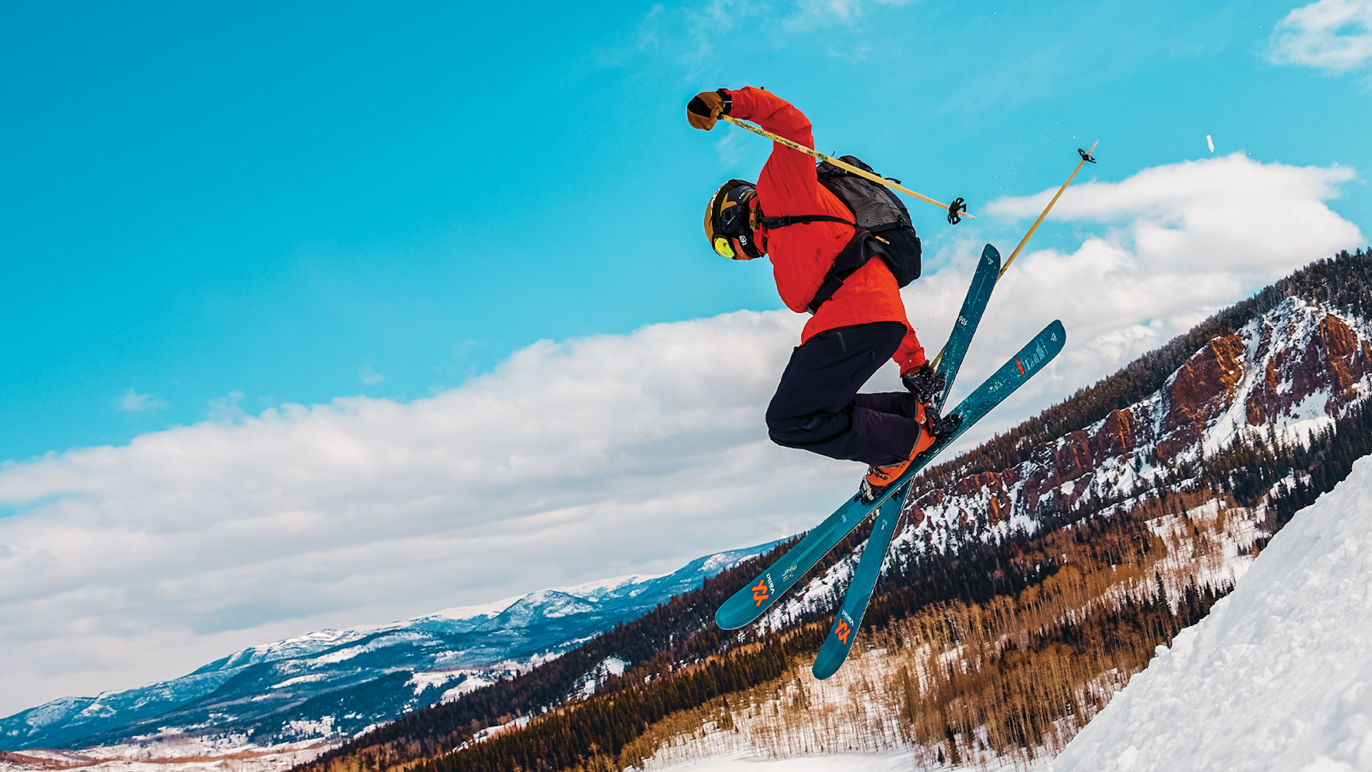 Skiers catches air in a snowfield in Colorado