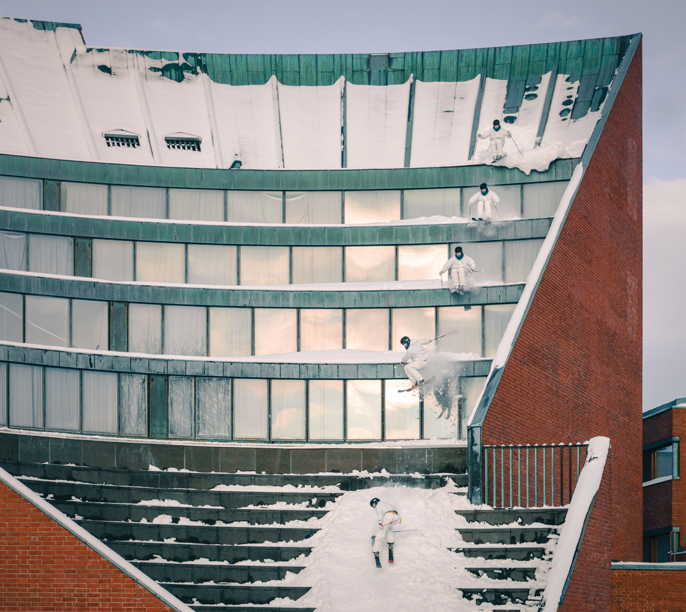 Skier Joona Sipola long exposure photo of a 180 off a building onto snowy steps