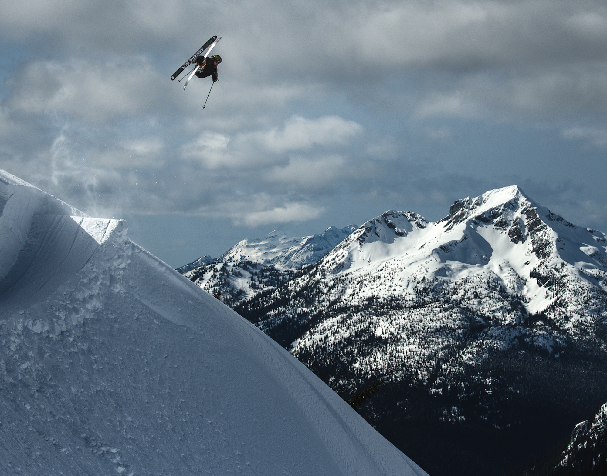 Skier Sammy Carlson in Revelstoke, BC catching huge air off a jump
