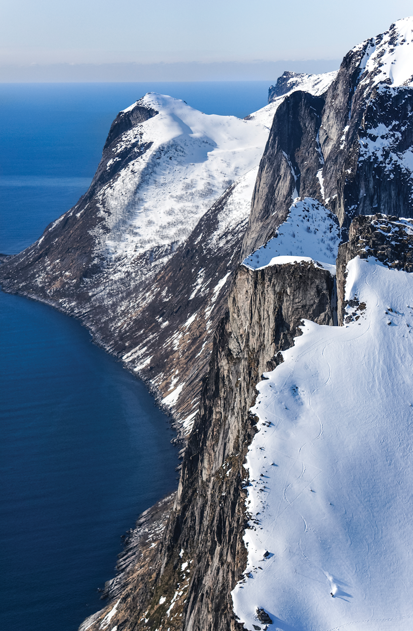 Skier Anne Wangler skiing down a steep mountain slope in Senja, NOR