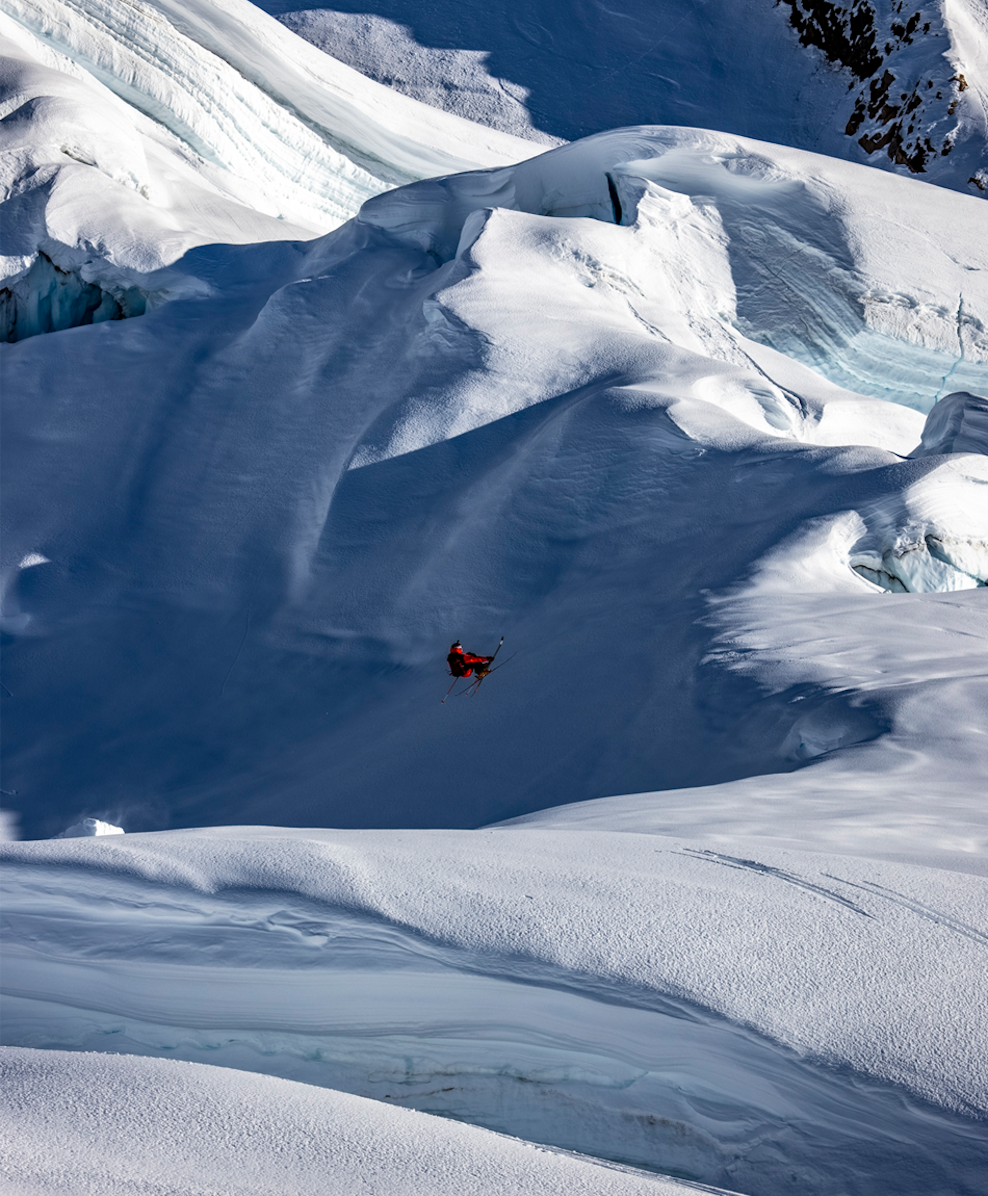 Skier in Alaska jumping from a slope