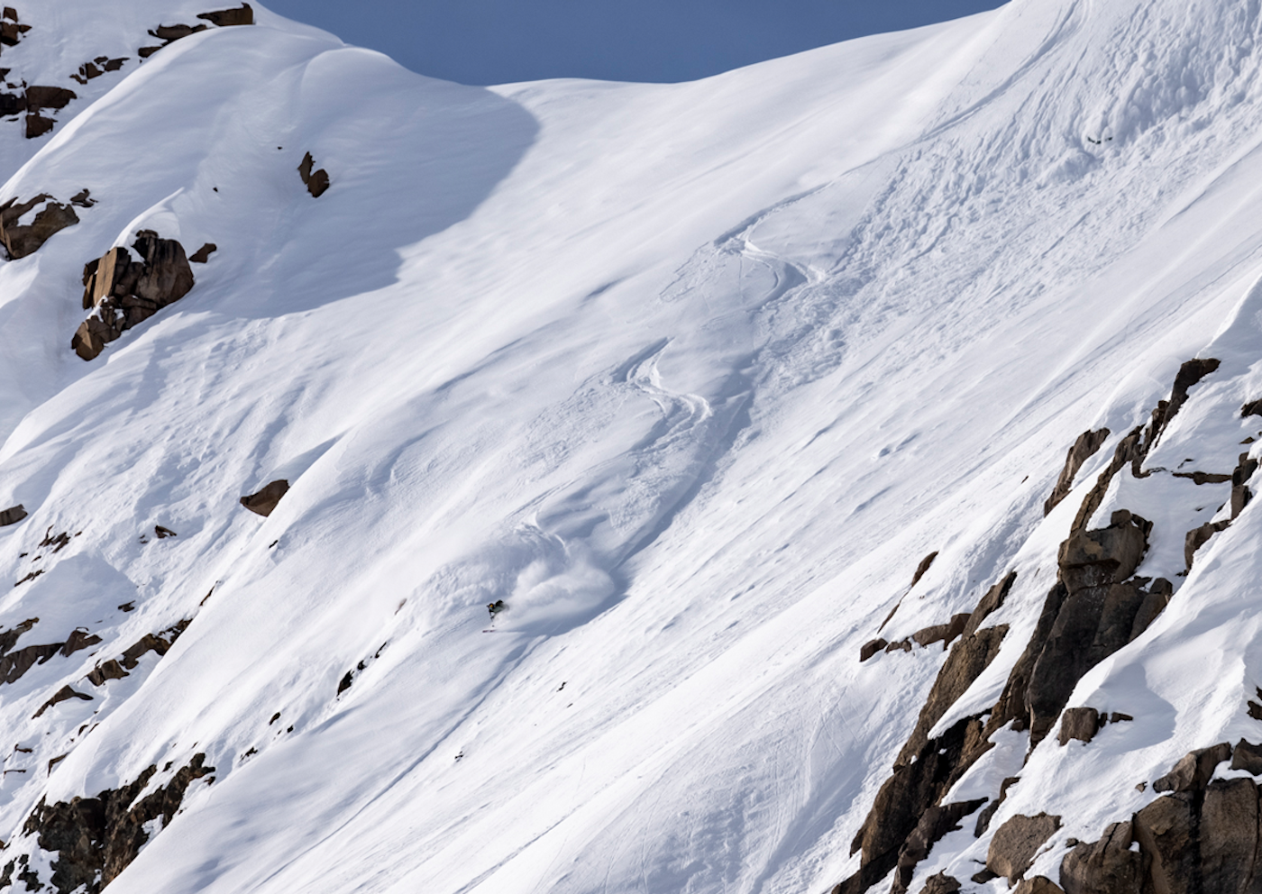 Skier skiing on a steep slope in Alaska