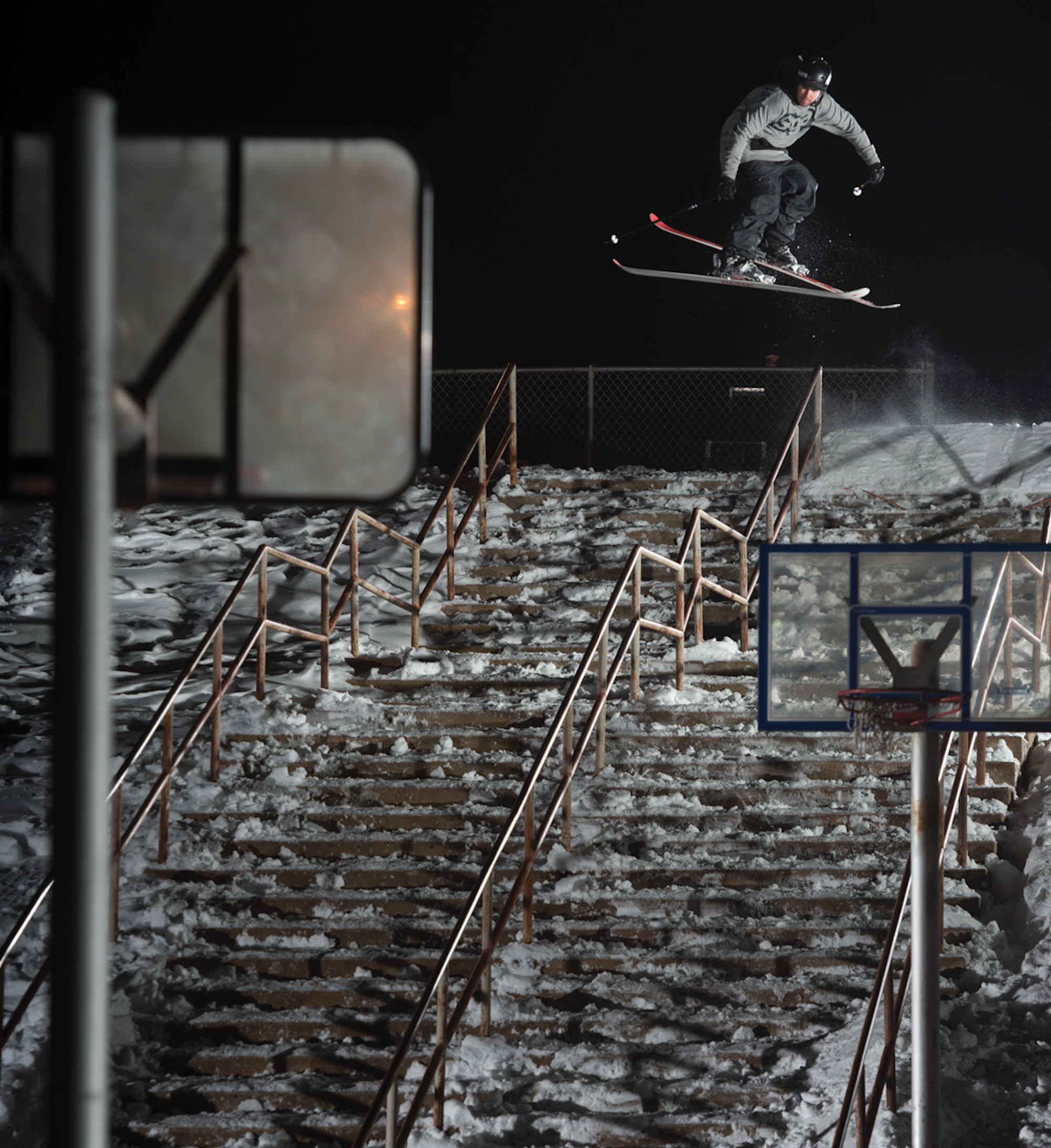 Skier Tim McChesney hitting a rail on an outdoor staircase