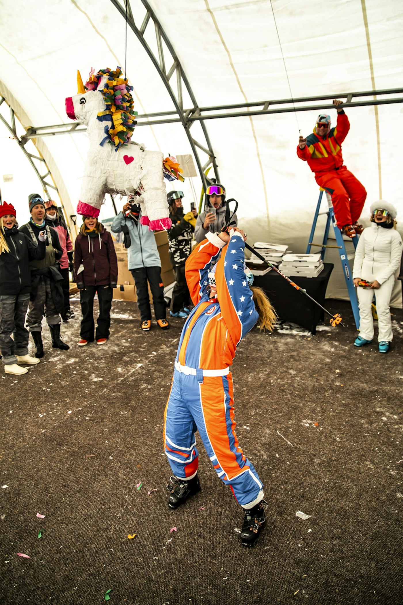 Skier hitting a pinata