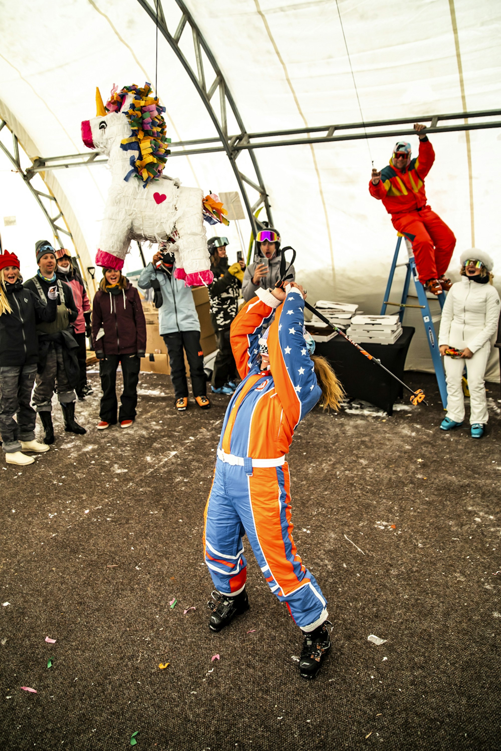 Skier hitting a pinata