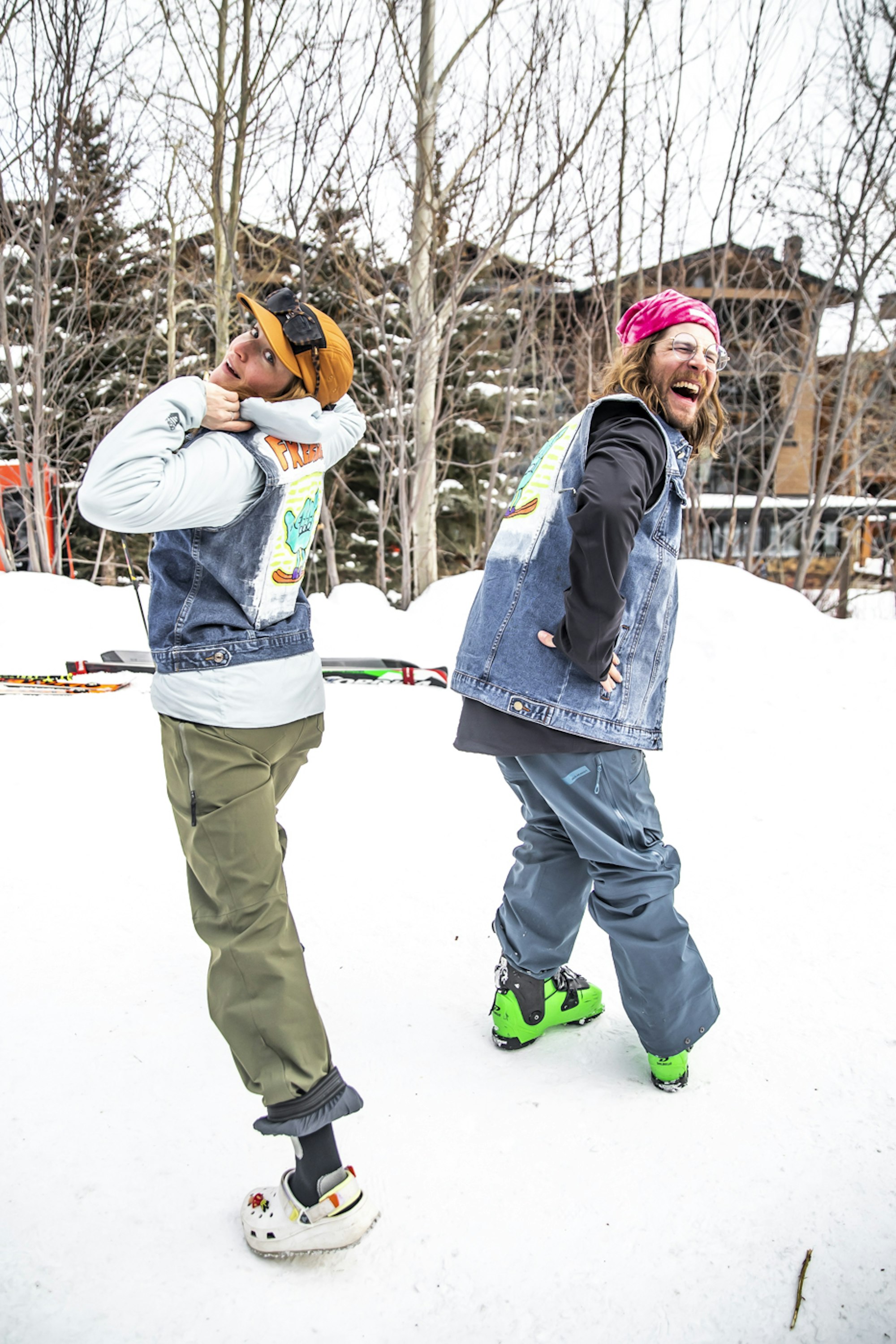 2 skiers in denim vests