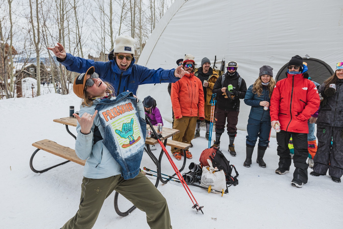 woman holding freeskier shirt