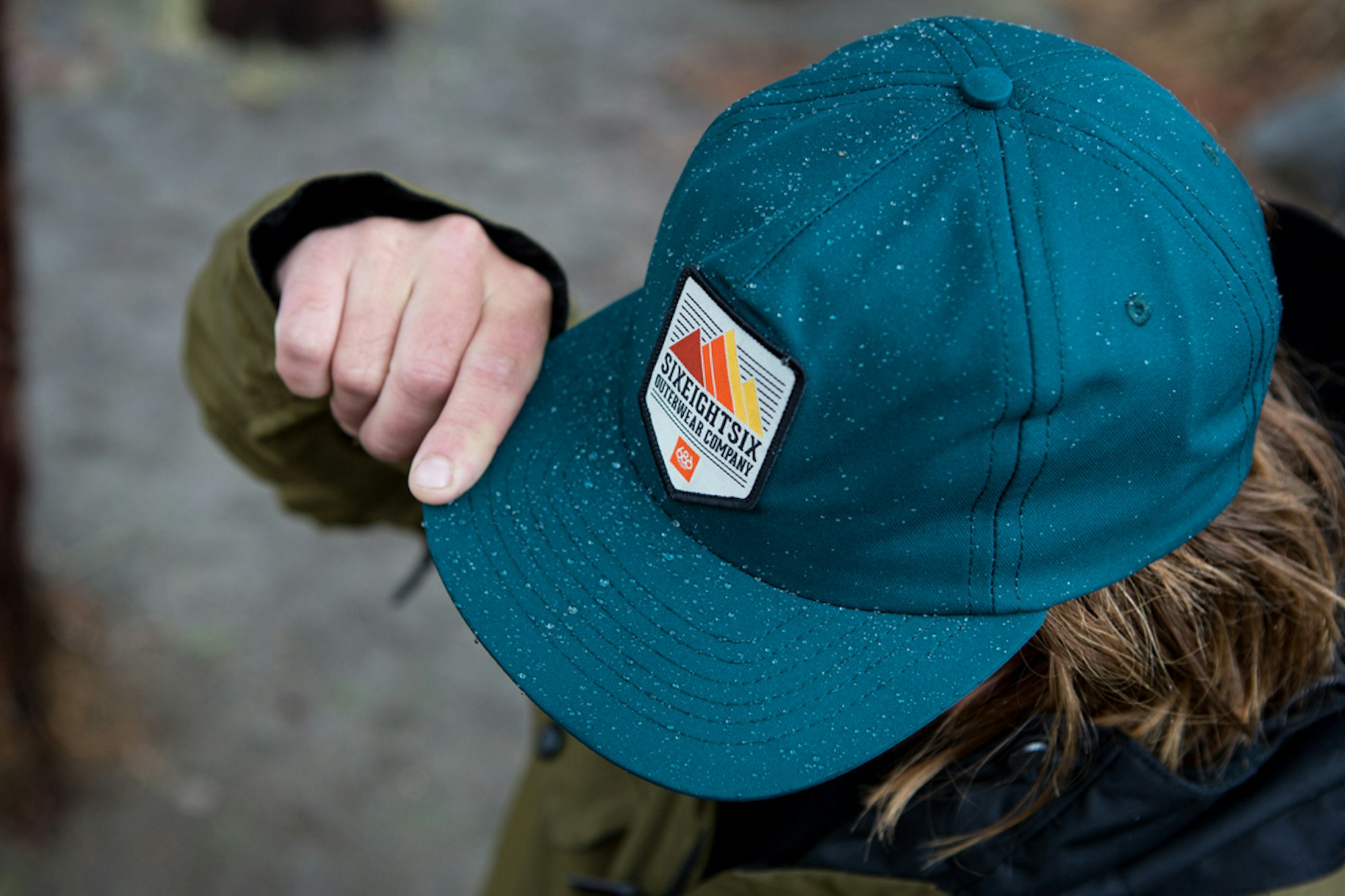 This snapback hat from 686 repels water just like your raincoat