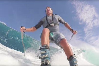 Total lunatic surfs Maui waves in his ski gear