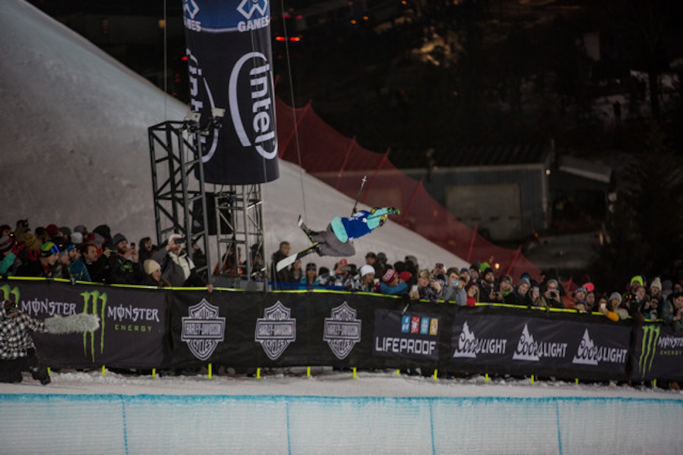 Gold Medalist Maddie Bowman grabbing mute above the crowd