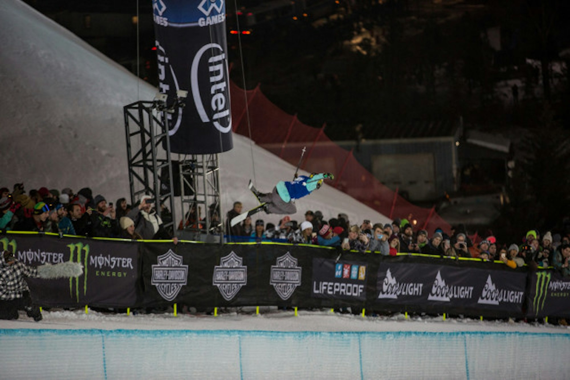 Gold Medalist Maddie Bowman grabbing mute above the crowd