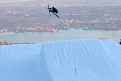 Teal Harle takes flight above Vancouver's urban landscape in "Terminal City"