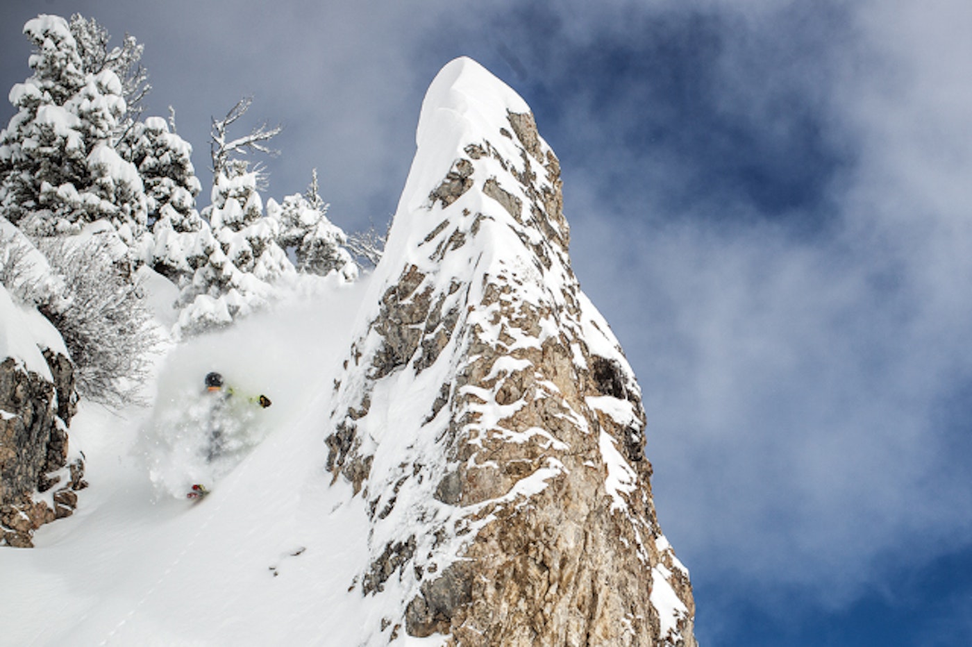 Pro skier Corey Seemann skiing deep powder.