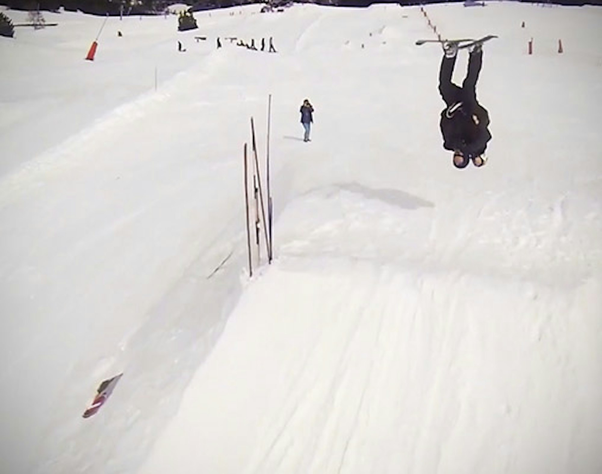 Video: Two skiers team up for the "piggyback backflip"