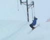 Skier stomps uphill double flatspin while riding Poma lift