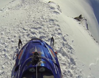 Erik Roner jumps Shane McConkey's snowmobile off 800-ft cliff