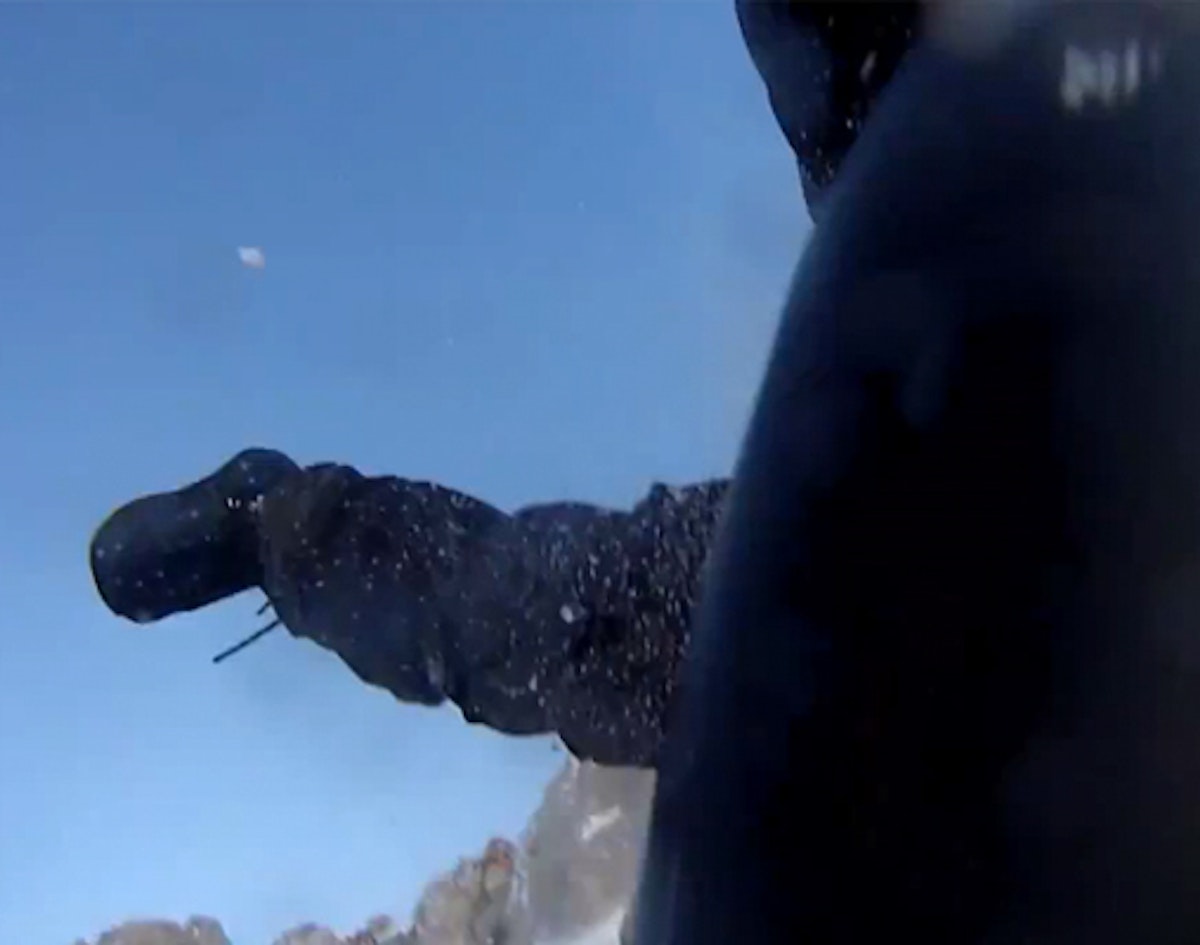 GoPro captures snowboarder falling over massive cliff