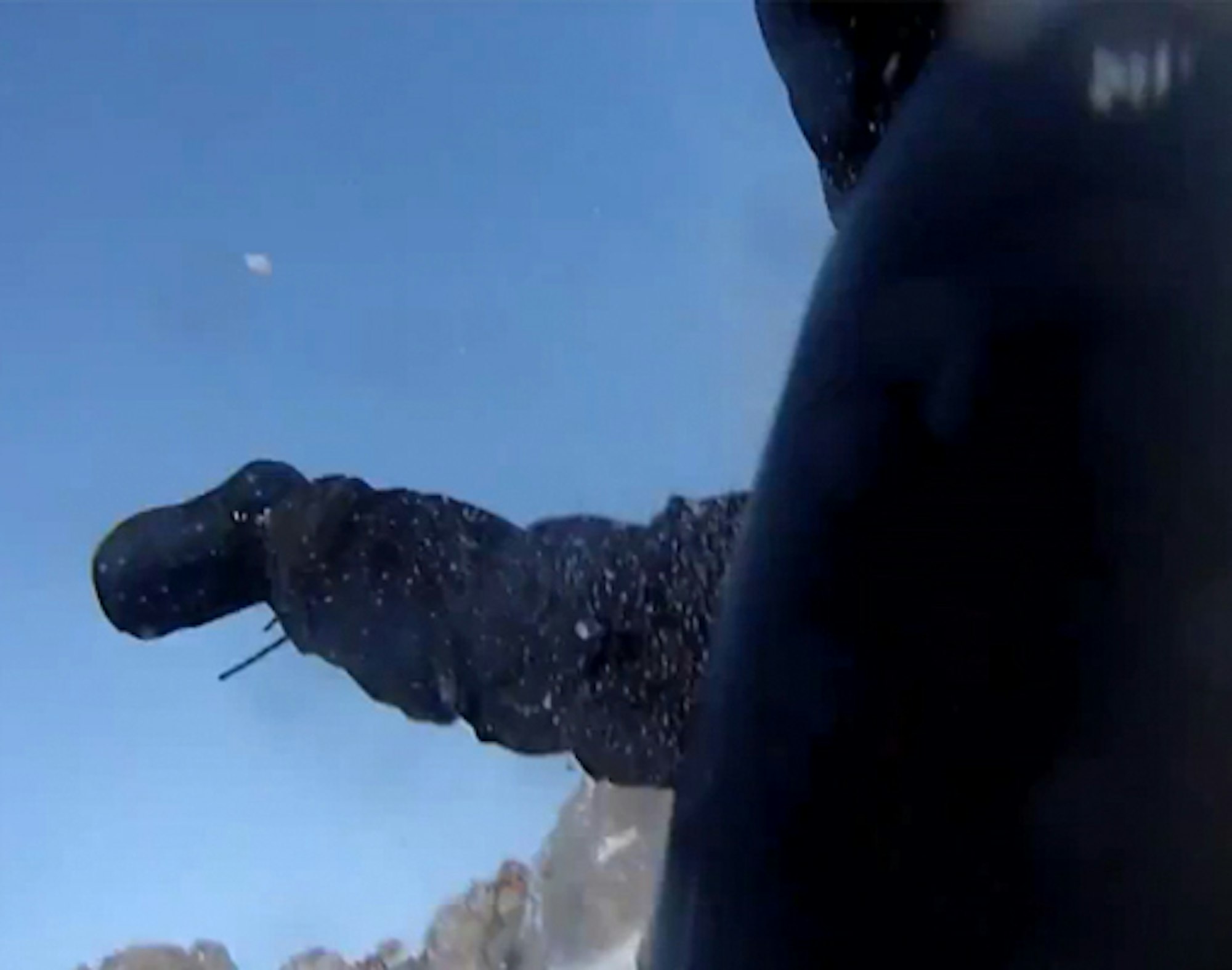GoPro captures snowboarder falling over massive cliff