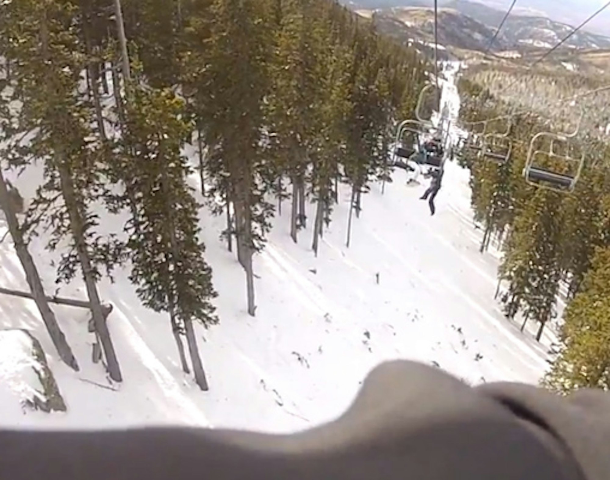 Guy hangs from chairlift, falls from 45 feet in the air [Graphic]