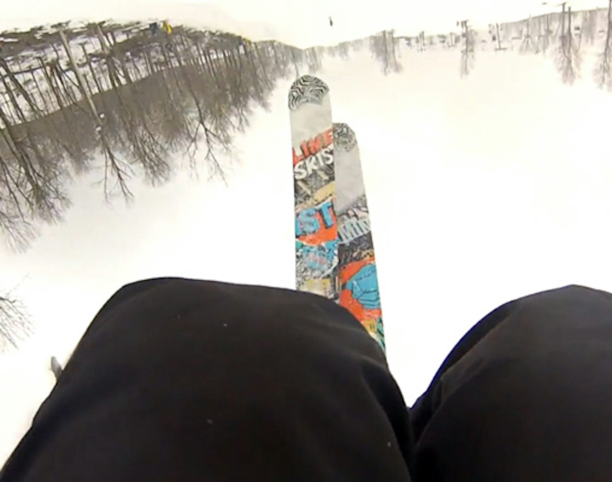 Skier catches tips on backflip attempt, face plants hard