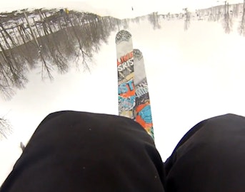 Skier catches tips on backflip attempt, face plants hard