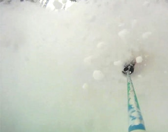 Dylan Siggers enjoys a little "pillow smash" in Revelstoke, with CMH heli