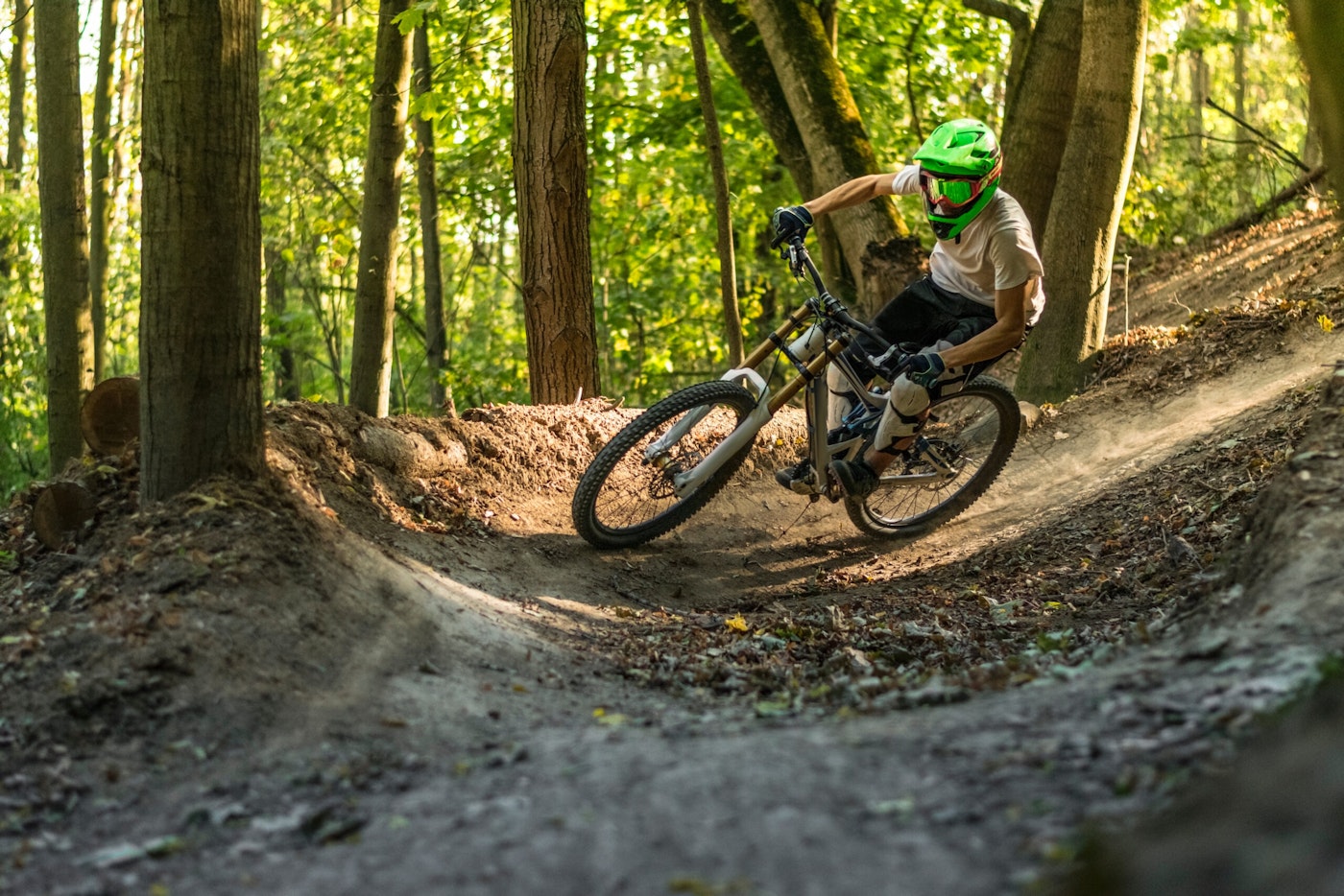 A mountain biker turns a corner in the forest