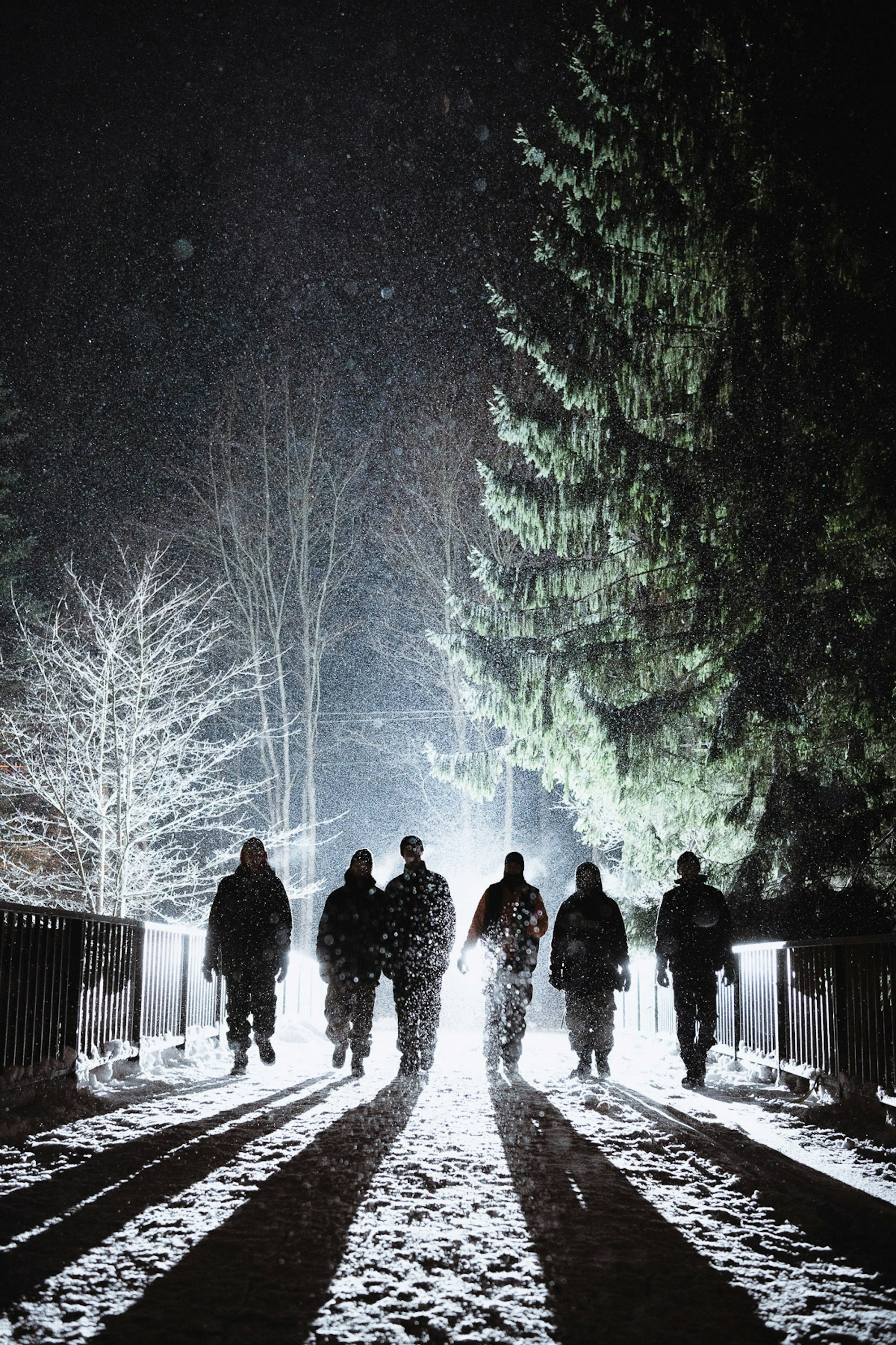 a group of 6 walking through the snow in Helsinki