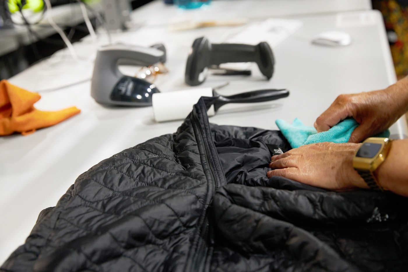 Tersus worker repairs a North Face Jacket