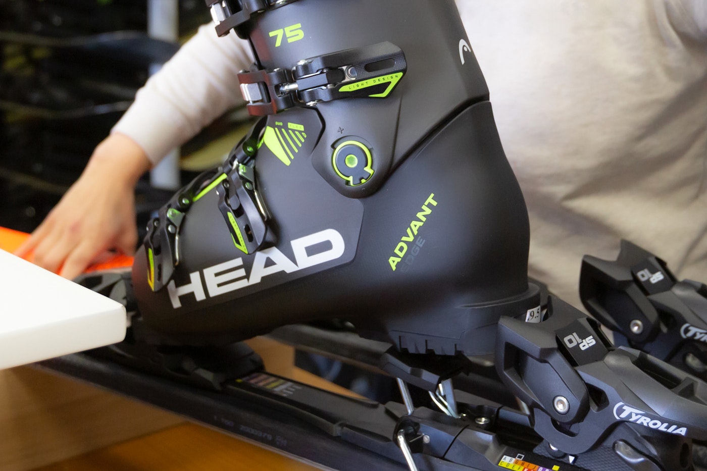 Ski boot and bindings being adjusted