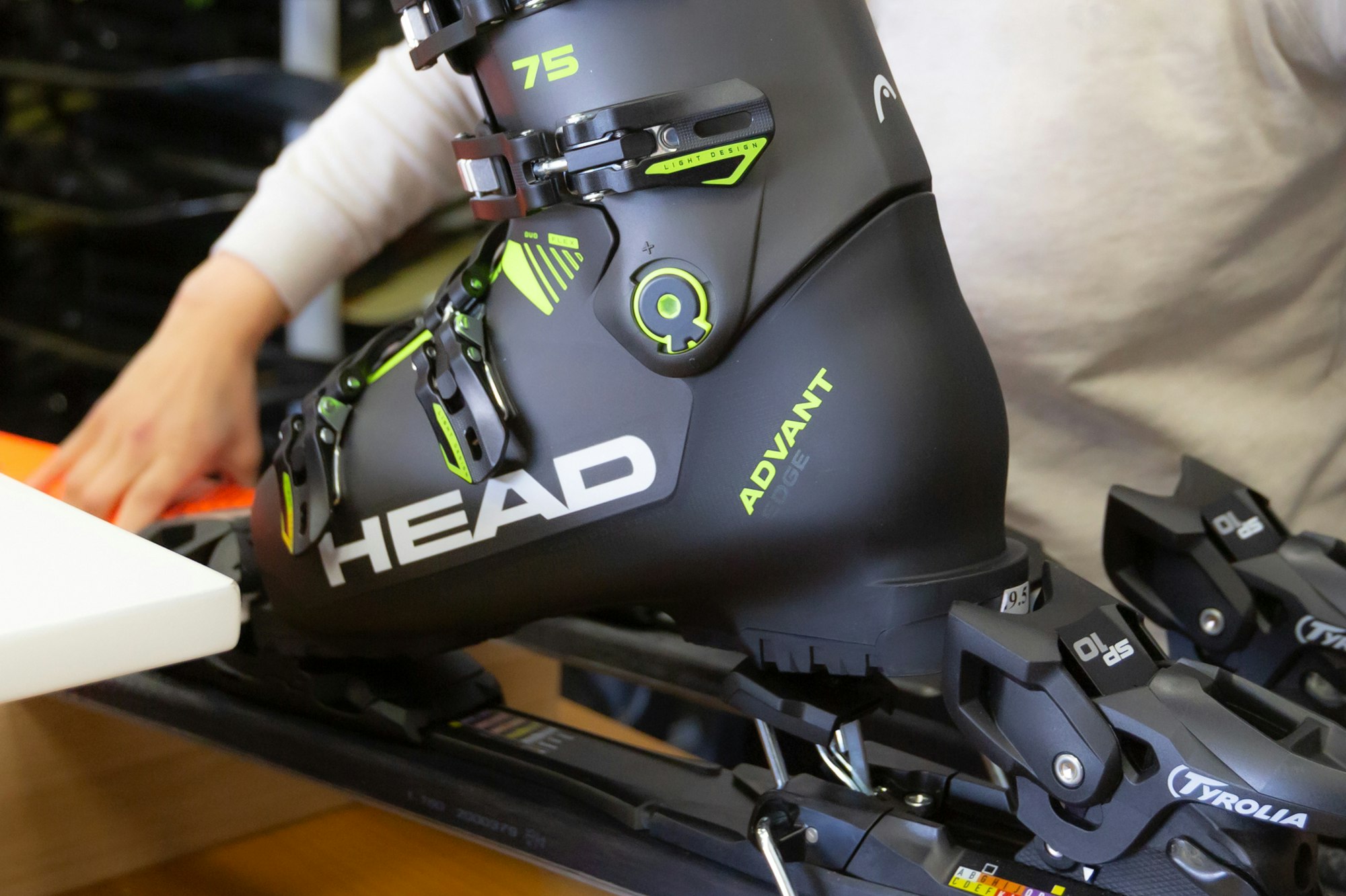 Ski boot and bindings being adjusted