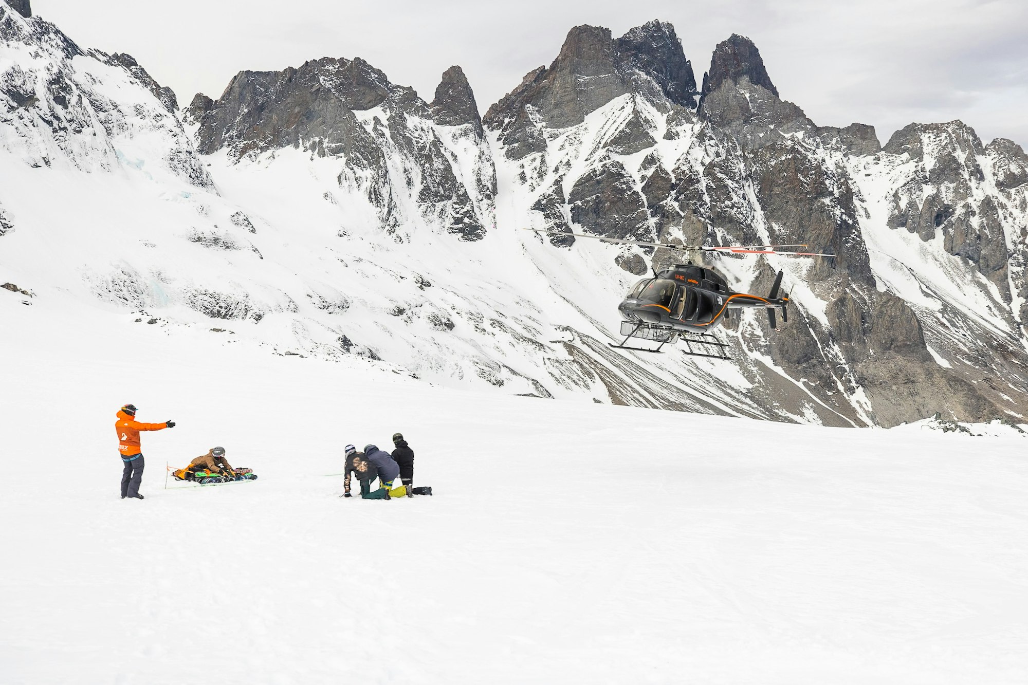 Helicopter taking off after dropping off skiers in Patagonia