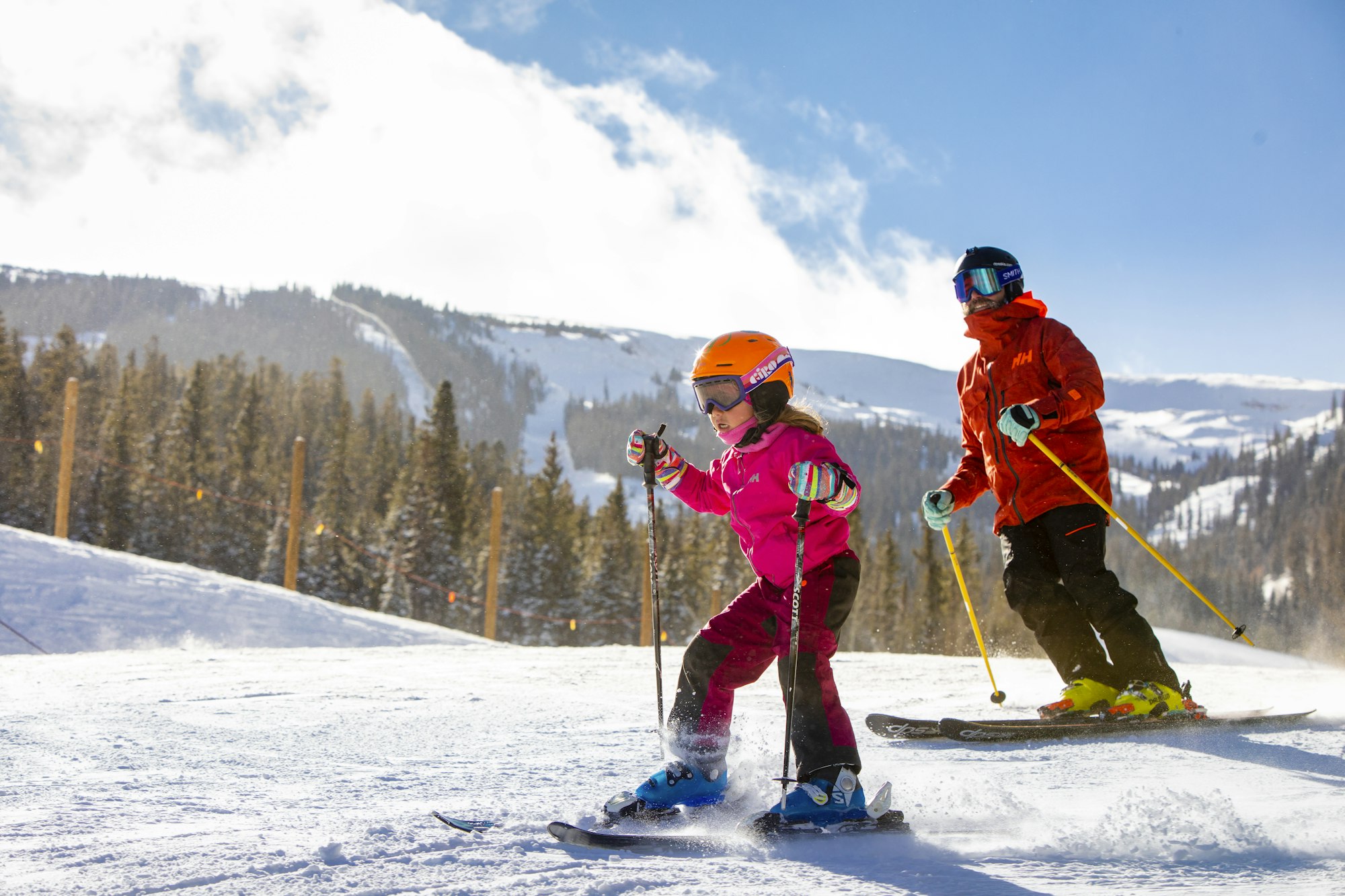 Father and daughter skiing