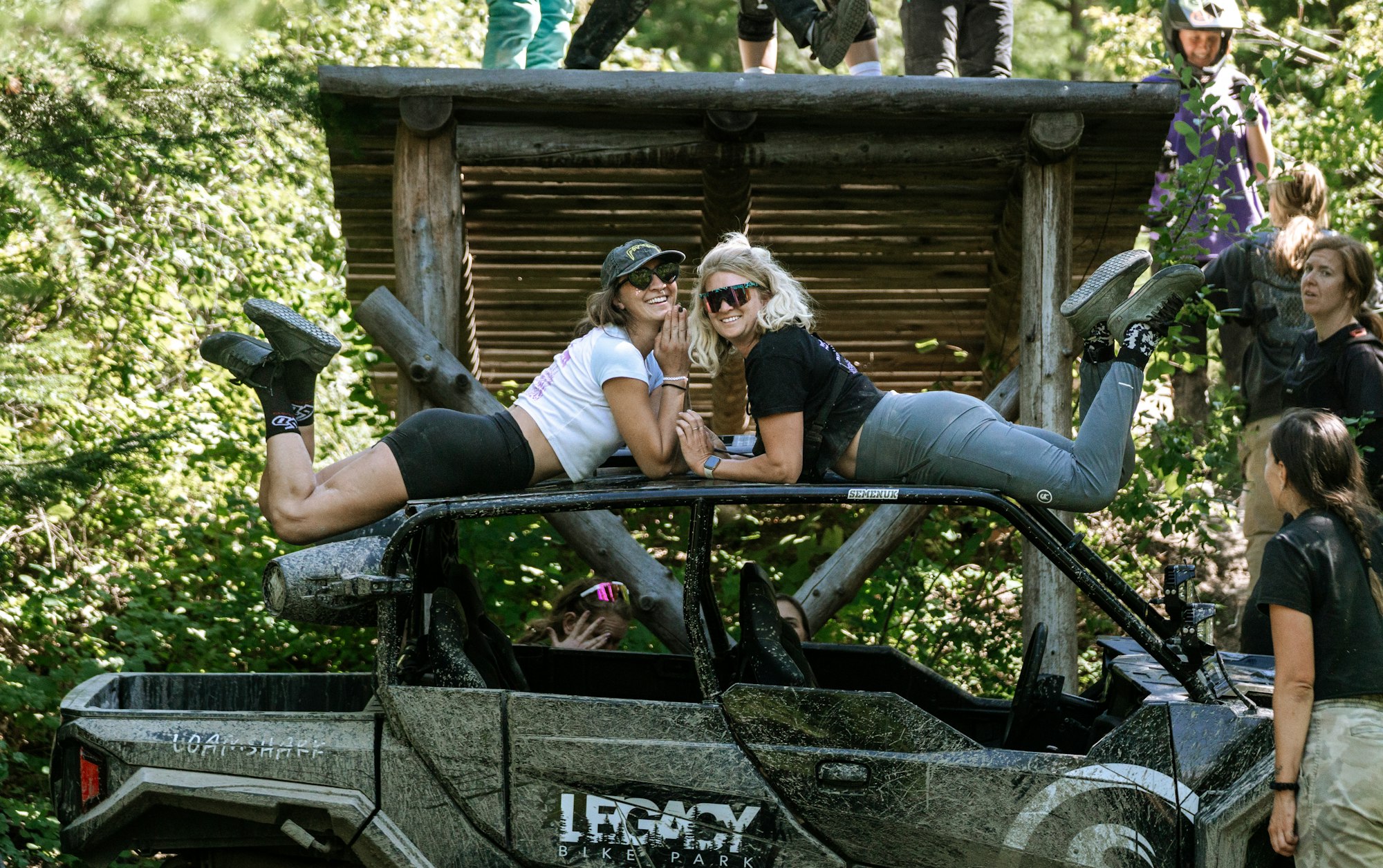 Kaytlyn Samuelson (left) and Heather Hilton (right) pose on top of 4-wheeler.