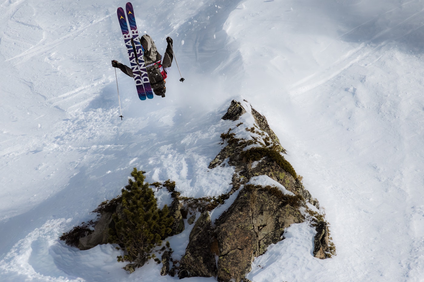 WeiTien Ho throwing a backflip at a Freeride World Tour competition.