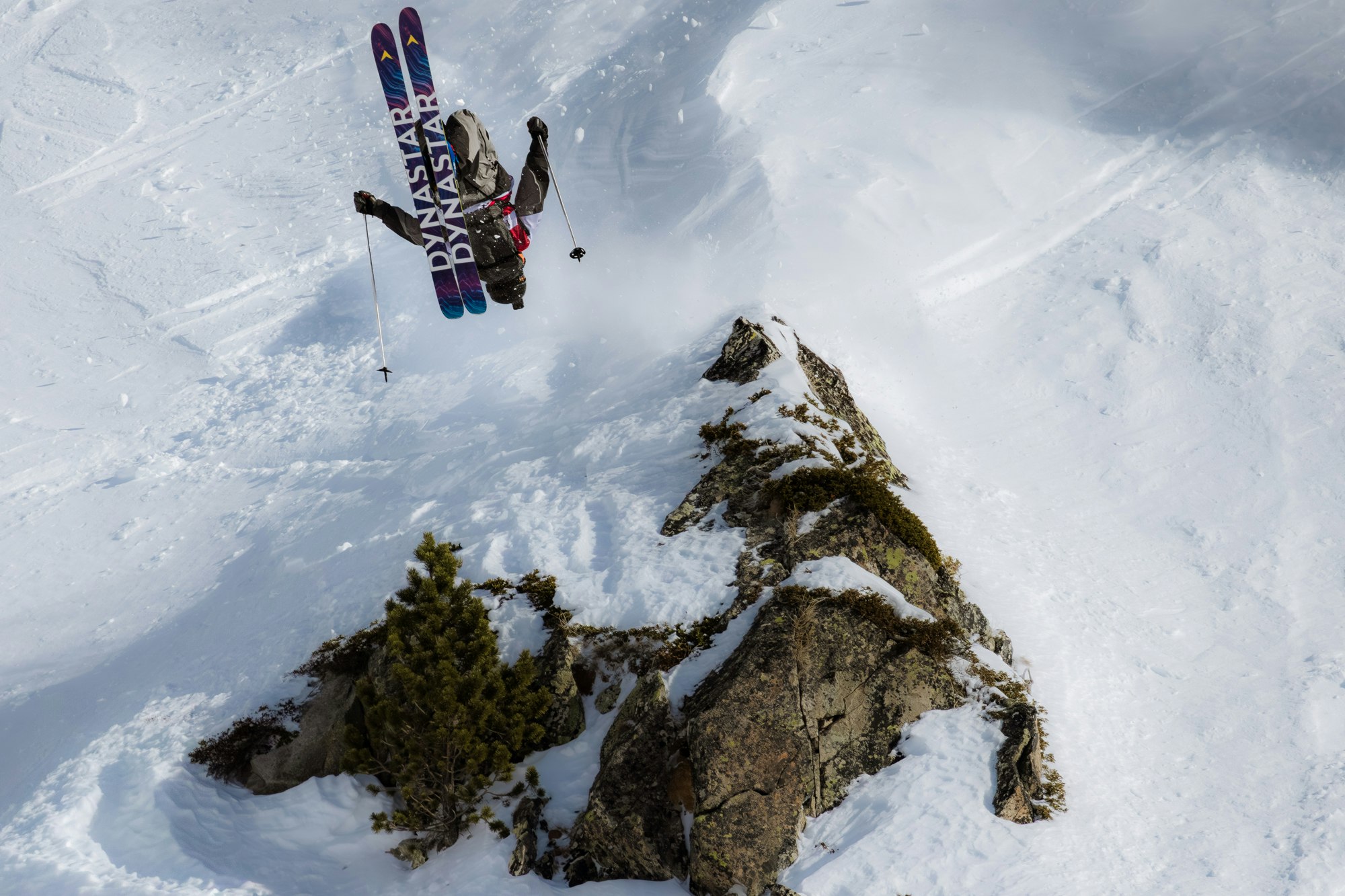 WeiTien Ho throwing a backflip at a Freeride World Tour competition.